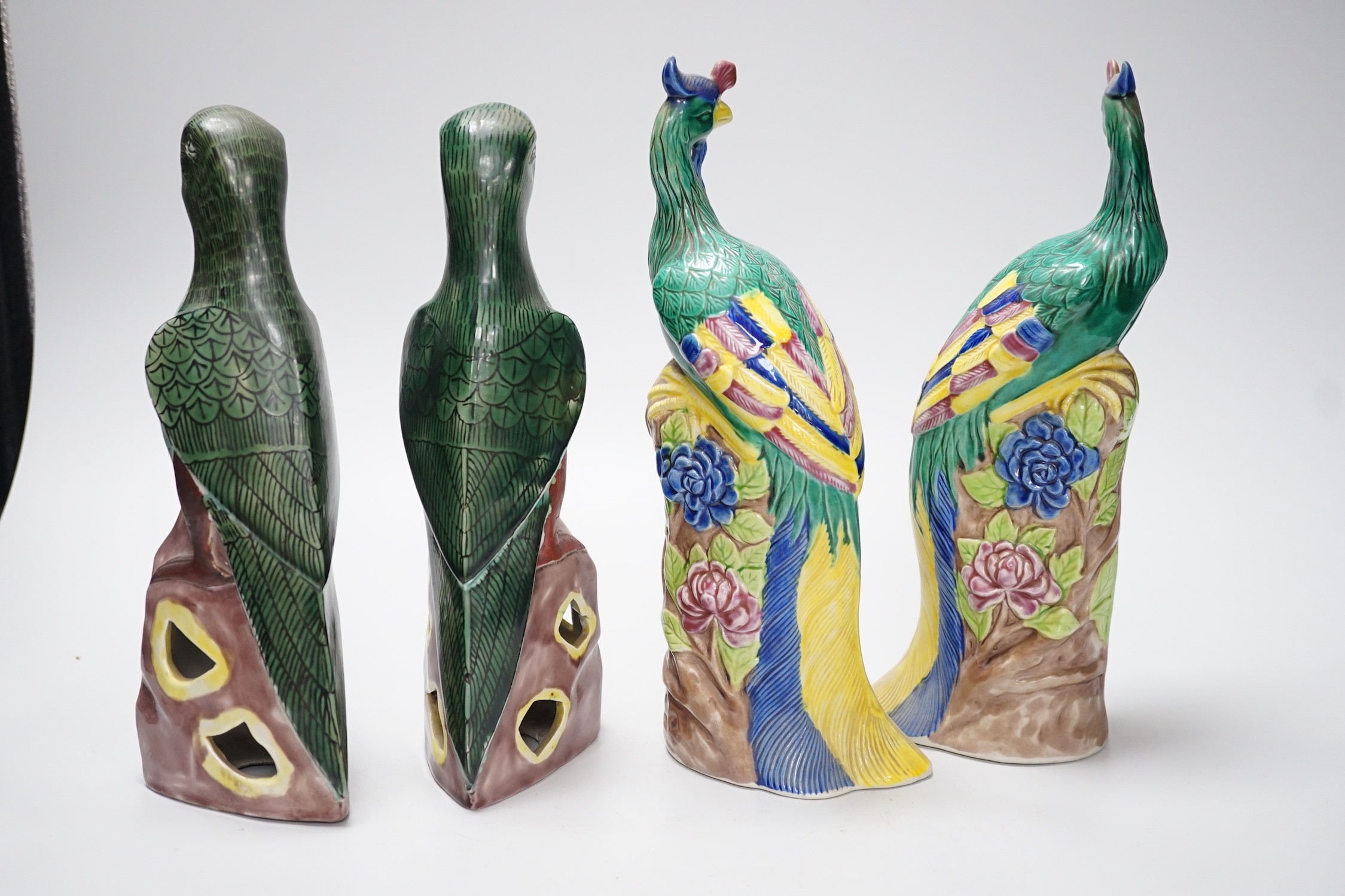 A pair of Chinese polychrome porcelain pheasants and a pair of parrots, tallest 27cm